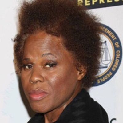 She is at an event posing for the camera.